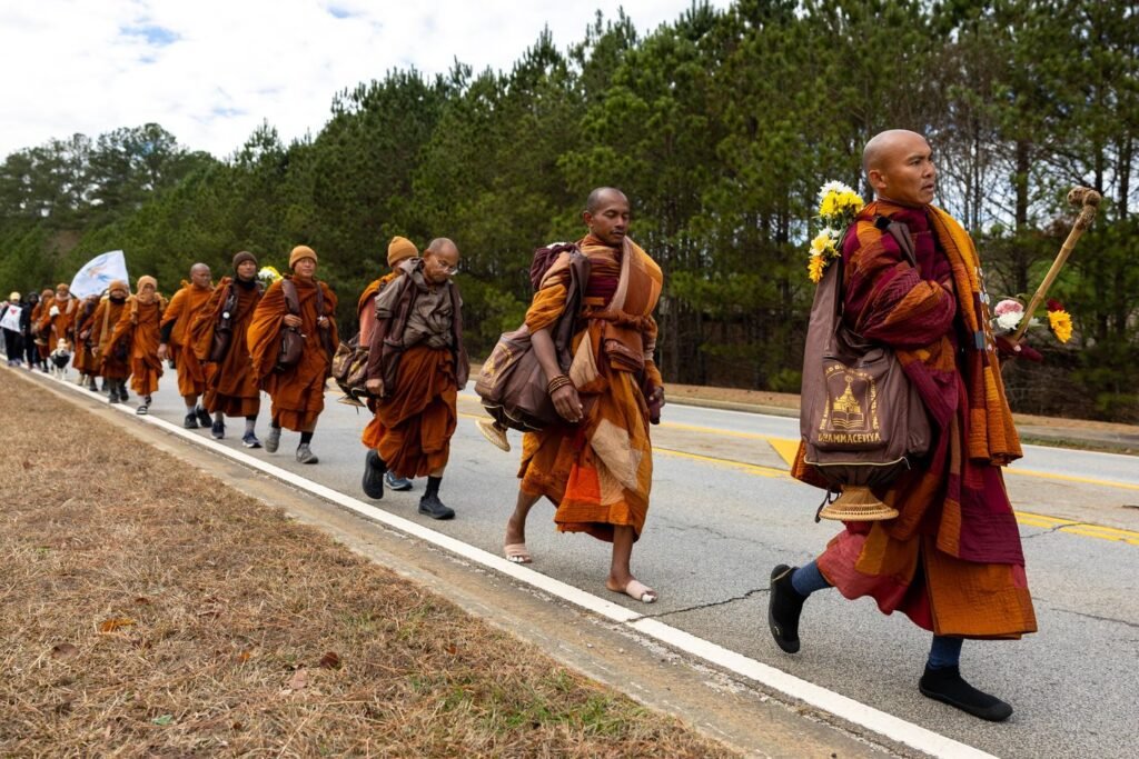 Buddhist monks persist in peace walk despite injuries as thousands follow them on social media