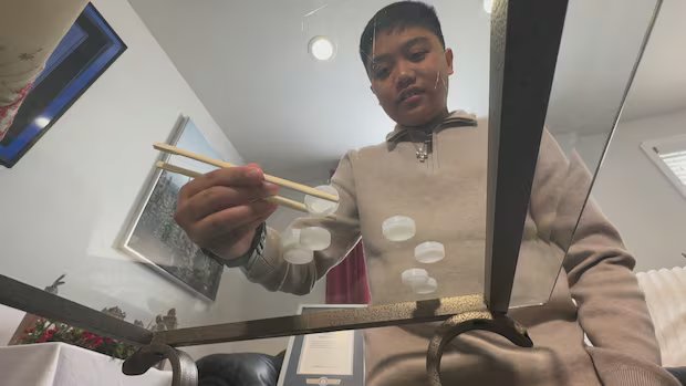 Ontario teen sets Guinness World record for stacking bottle caps using chopsticks Ontario teen sets Guinness World record for stacking bottle caps using chopsticks