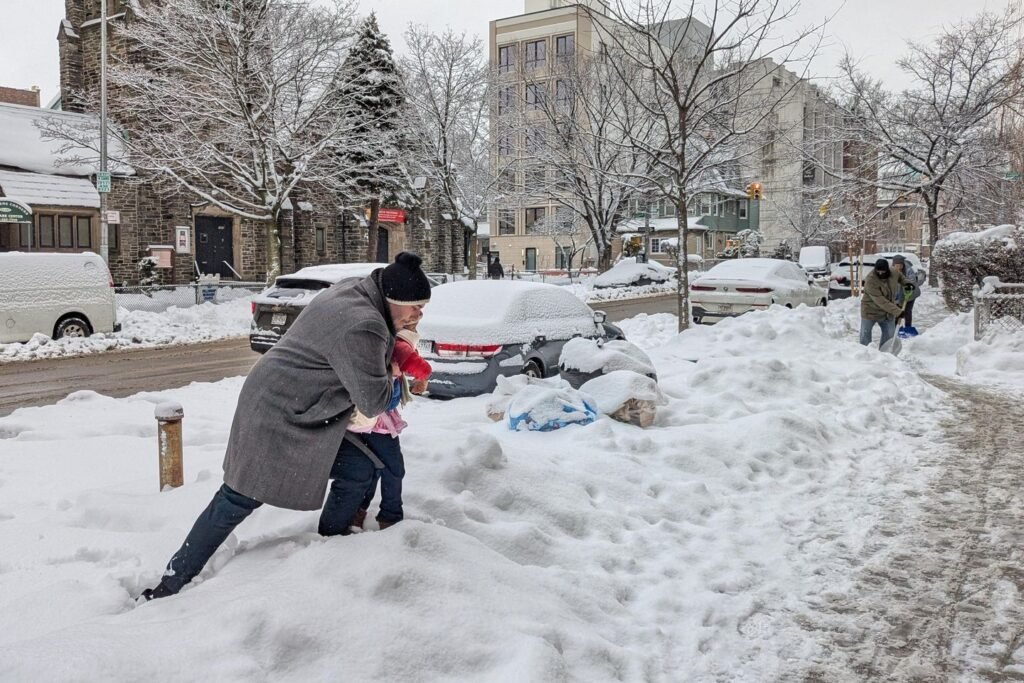 More snow falls on the Northeast U.S., where huge piles remain from the last storm