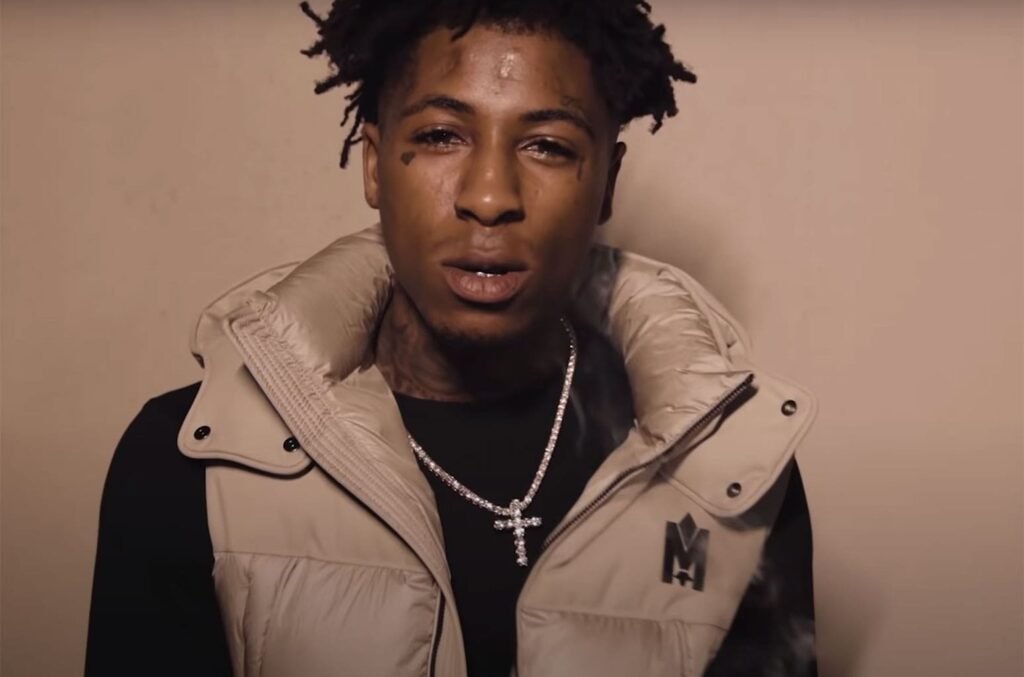 NBA YoungBoy Teases New Music With Cryptic Message And Weapon Display