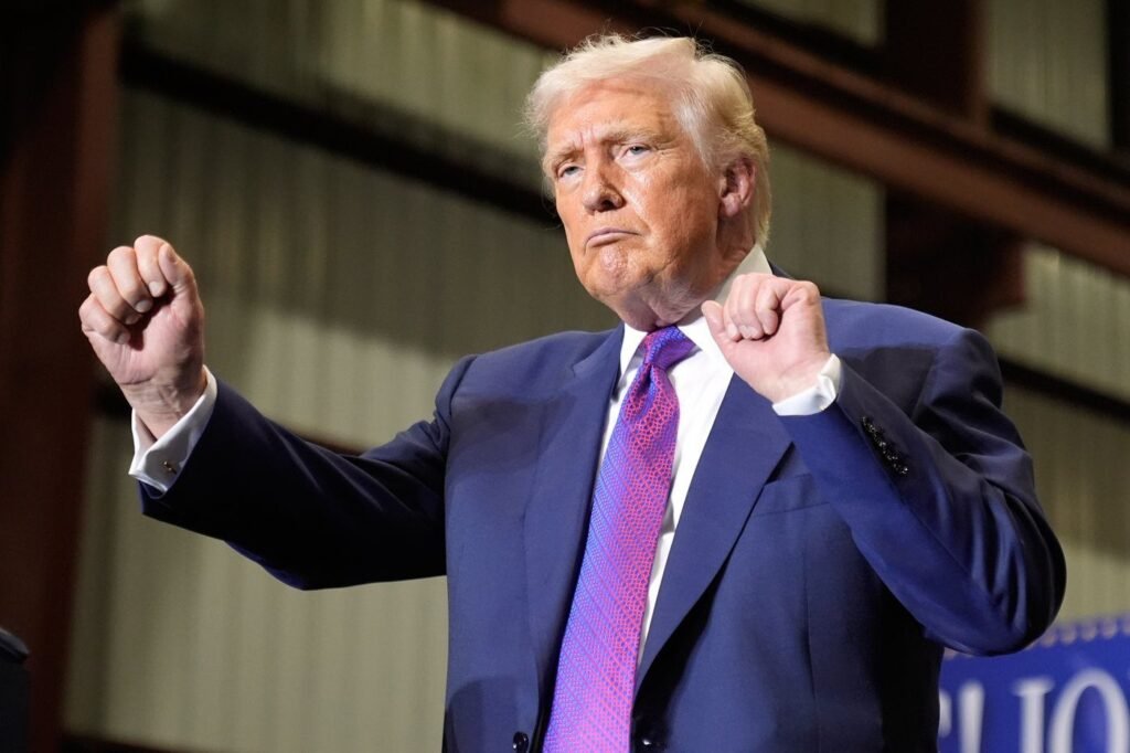 The Latest: Trump's entourage stocked with people who promoted election loss falsehoods