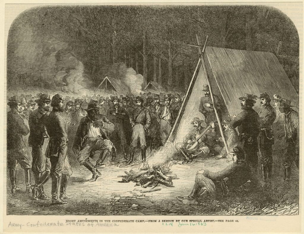 “Esclavos leales” y entretenimiento en fogatas en el campamento confederado de Frank Vizetelly – Celebrity Land “Esclavos leales” y entretenimiento en fogatas en el campamento confederado de Frank Vizetelly – Celebrity Land