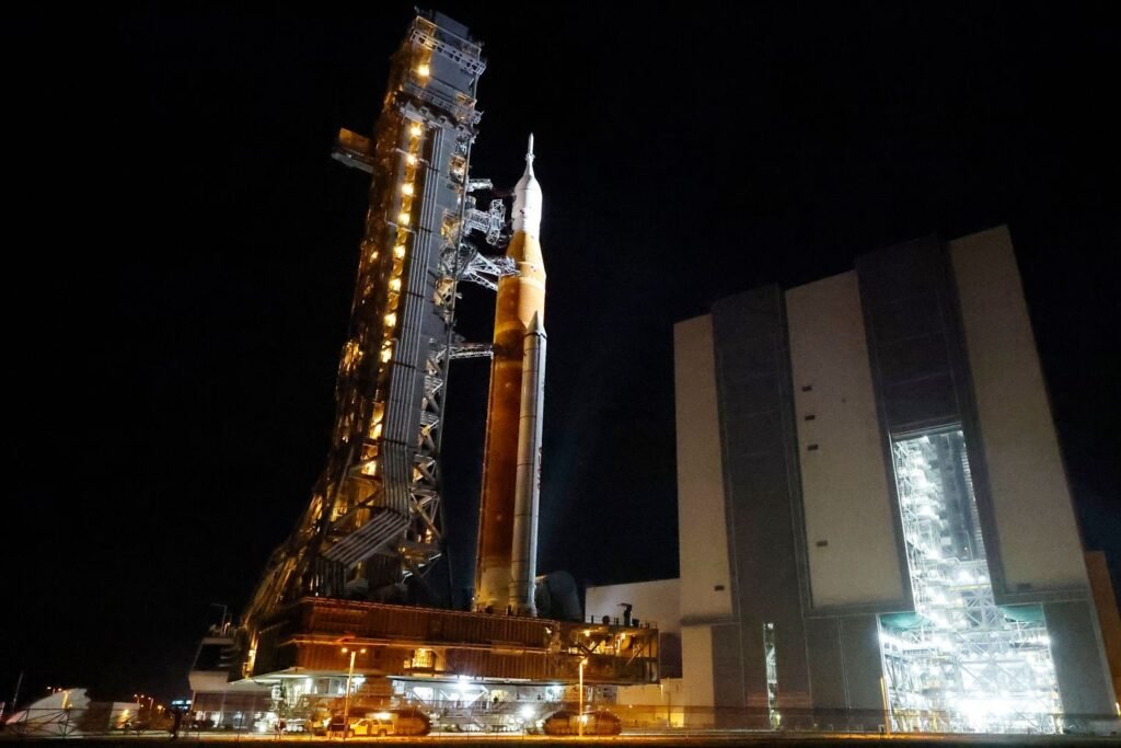 NASA hauls its repaired moon rocket from the hangar back to the pad for an early April launch
