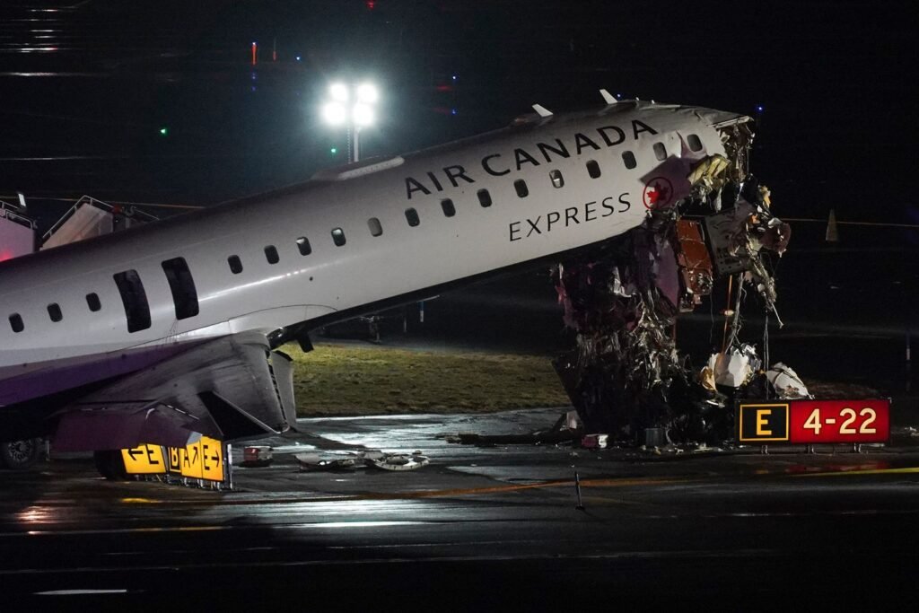 Pilot and copilot killed in collision between jet and fire truck at New York's LaGuardia Airport