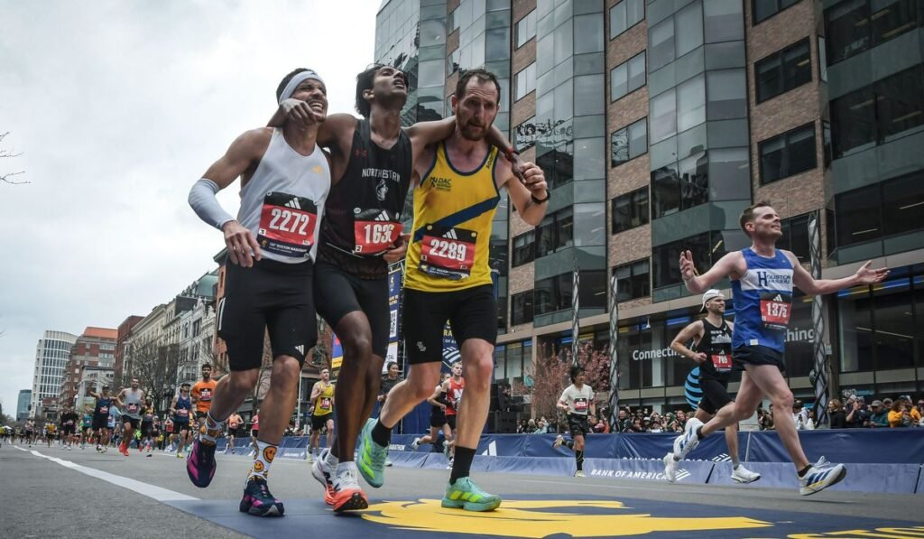 Runners were struggling to finish Boston Marathon when competitors came along and helped them across