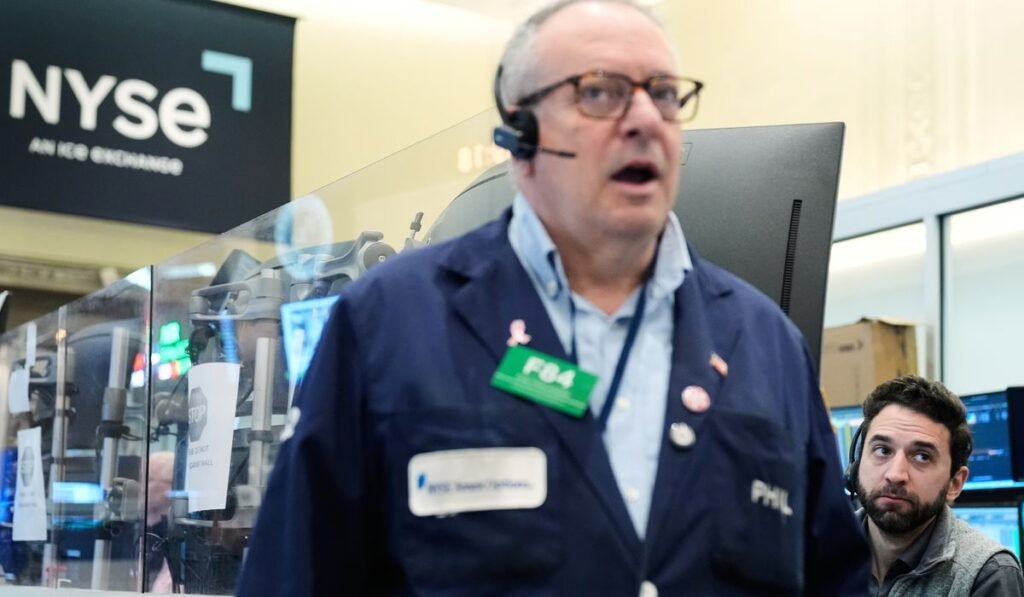 Wall Street rallies to the edge of its all-time high as oil prices ease