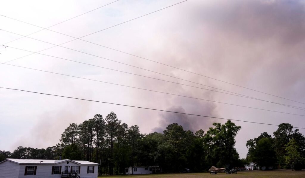 Wildfires across Georgia and Florida have destroyed nearly 50 homes and are forcing evacuations