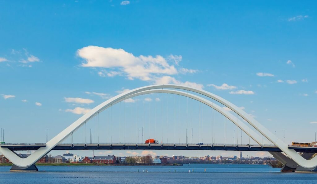 Man scales Washington bridge arch with black ribbon to oppose Iran war