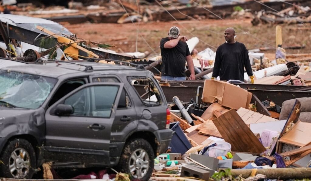 Survivors of Mississippi tornadoes crawled under furniture and held onto their kids