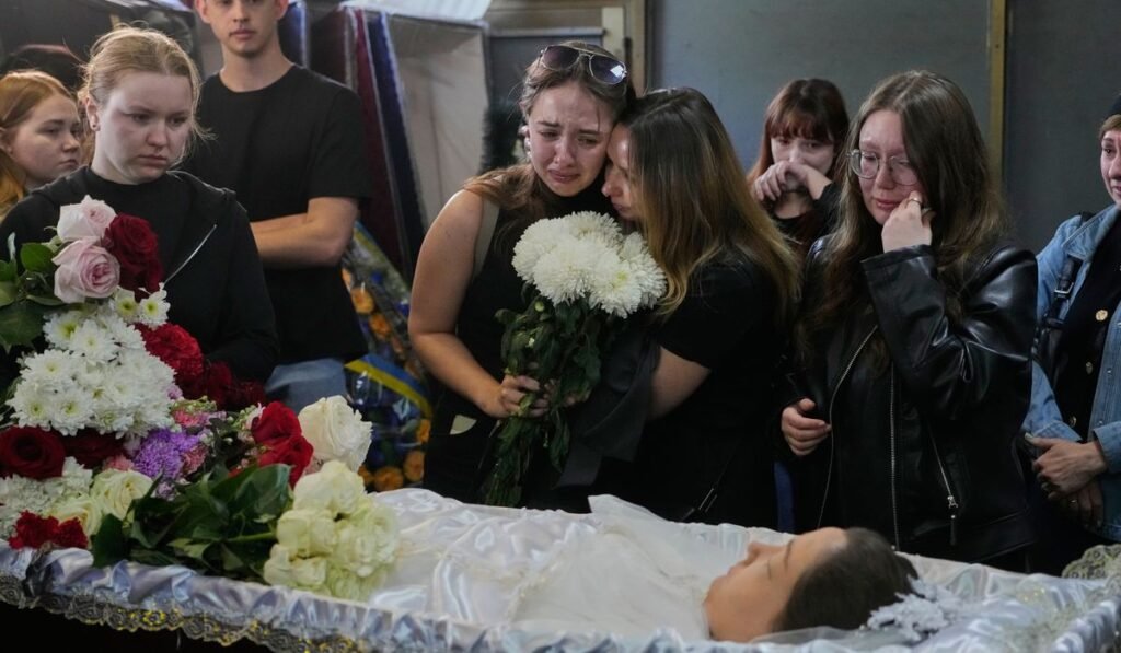 Young Kyiv couple killed in a fierce Russian airstrike hoped to start a family, mourners say