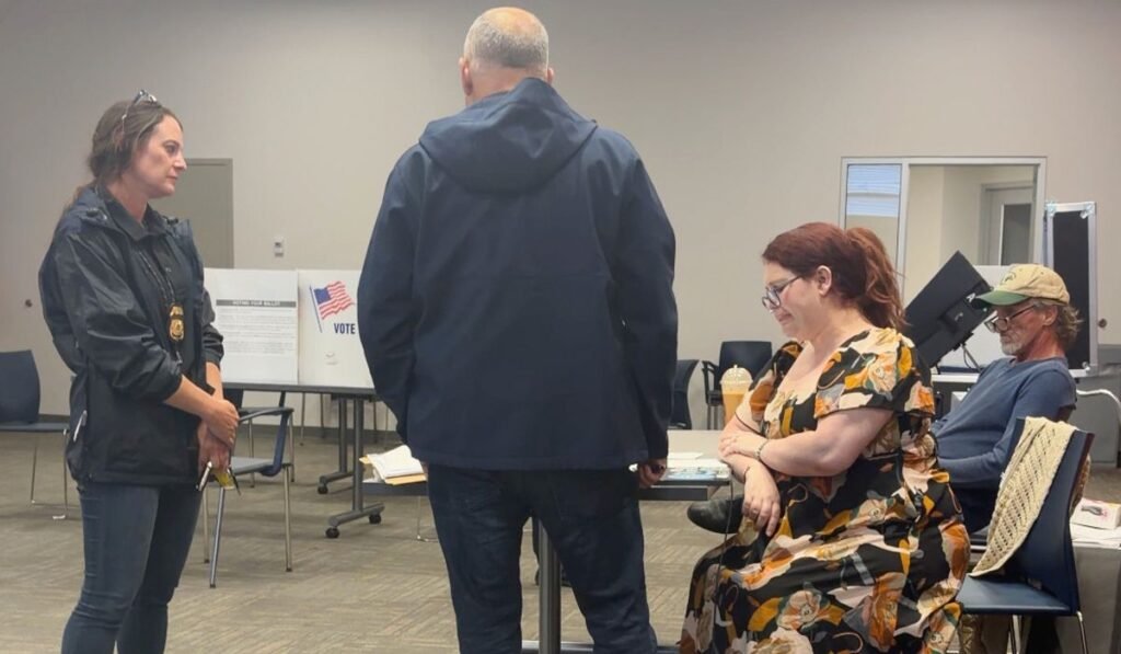 Election worker says federal officers confronted her at polls over social media post criticizing ICE