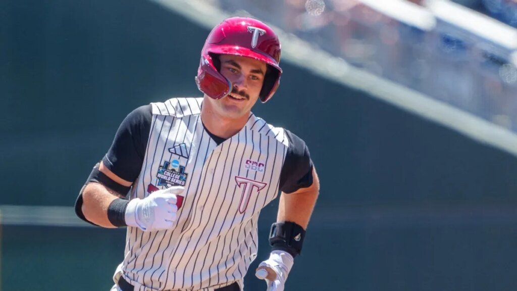 Cinderella Troy rallies for 12-8 win, knocks Ole Miss out of MCWS Cinderella Troy rallies for 12-8 win, knocks Ole Miss out of MCWS