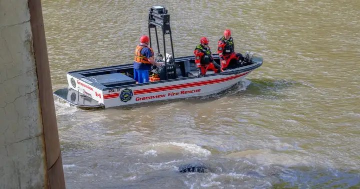 Driver missing after crane goes over bridge and into river in northern Alberta: RCMP Driver missing after crane goes over bridge and into river in northern Alberta: RCMP