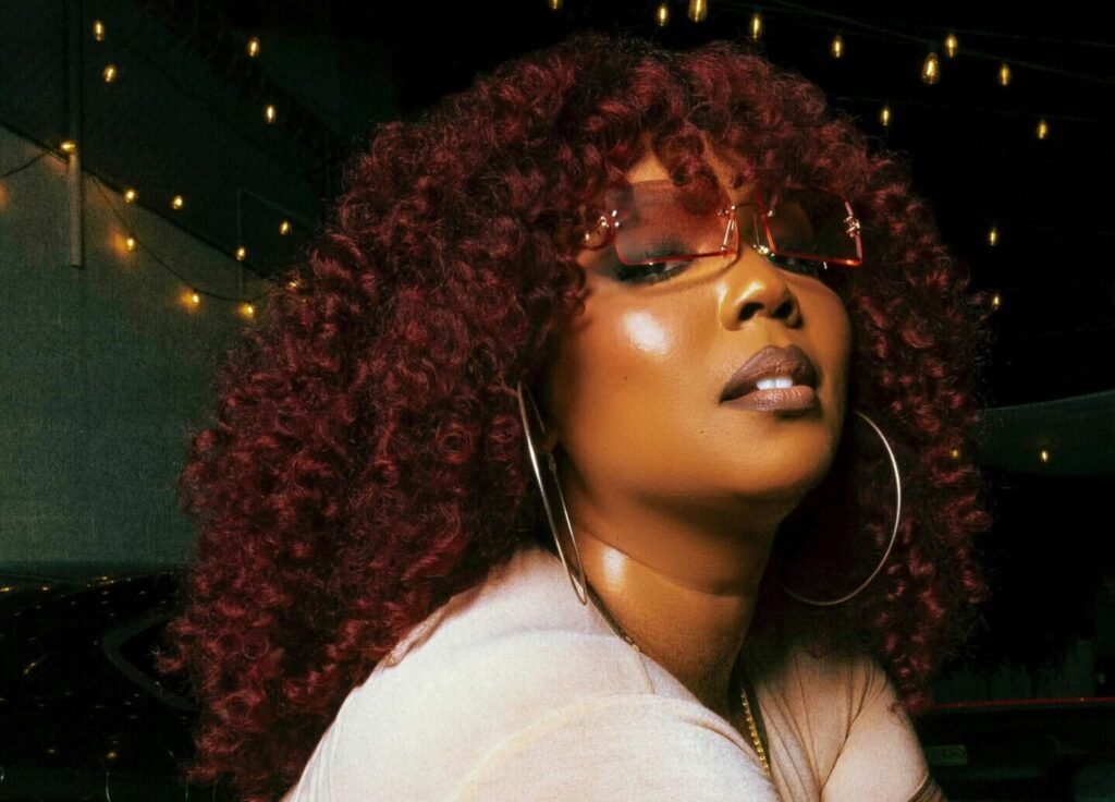 Lizzo Puts Her Own Brand On Notice With A Cheeky Timeout Gesture