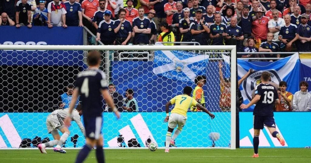 McKenna presents Vinicius with a gift as Brazil take lead against Scotland before VAR escape