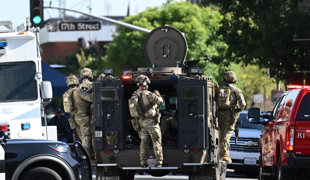 Standoff with bomb-carrying man enters second day at California bank Standoff with bomb-carrying man enters second day at California bank