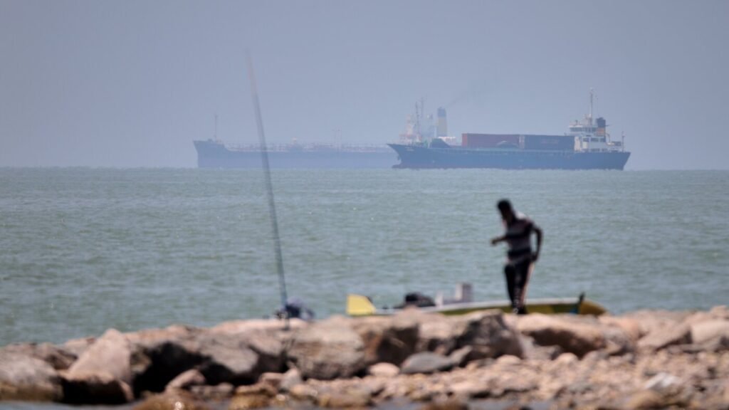 UN agency pauses evacuation of ships through the Strait of Hormuz after attack on vessel : NPR