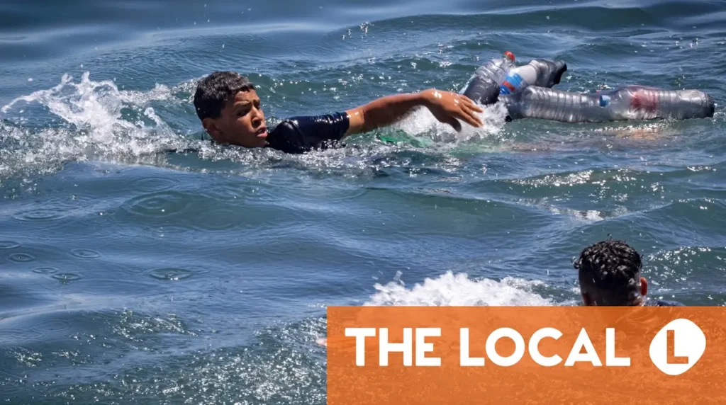 Hundreds of migrants swim from Morocco to Spain's Ceuta territory