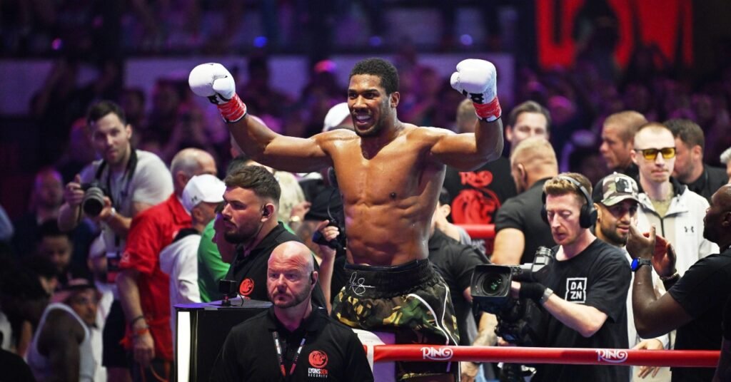 Joshua dedicates chaotic win over Prenga to late team-mates as Fury bout remains on course