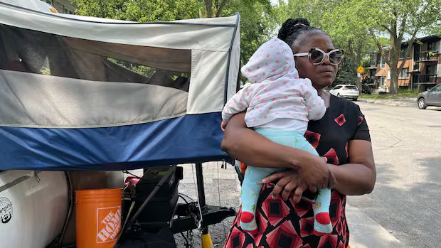 Part of Montreal family camping outside its duplex allowed to move in, Quebec housing tribunal rules Part of Montreal family camping outside its duplex allowed to move in, Quebec housing tribunal rules