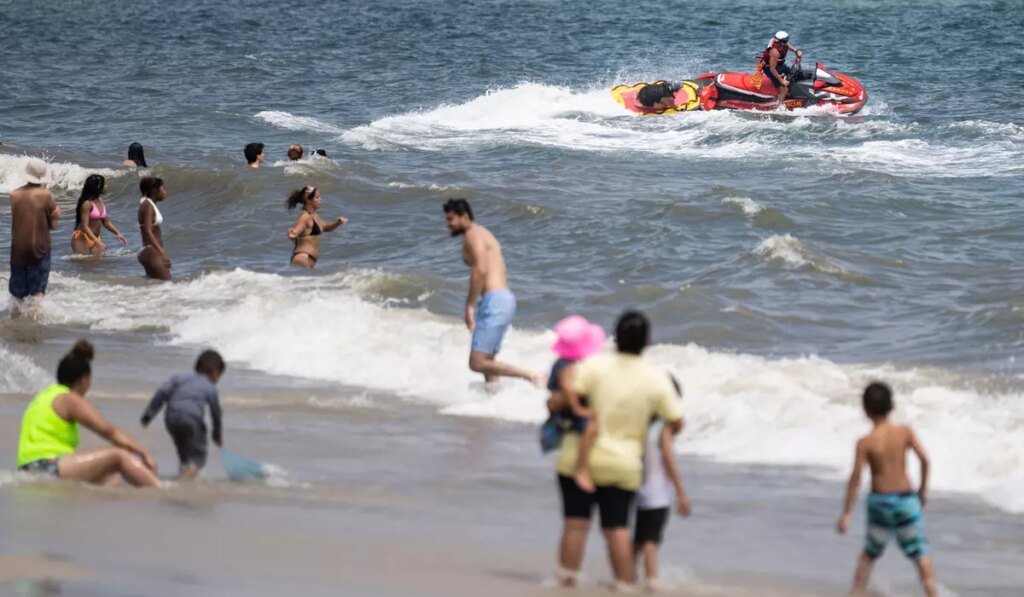 Swimmer bitten on the foot at New York beach in a suspected shark attack Swimmer bitten on the foot at New York beach in a suspected shark attack