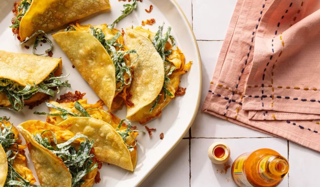 How to make crispy Buffalo chicken tacos with collard slaw and a protein-packed ranch dressing How to make crispy Buffalo chicken tacos with collard slaw and a protein-packed ranch dressing