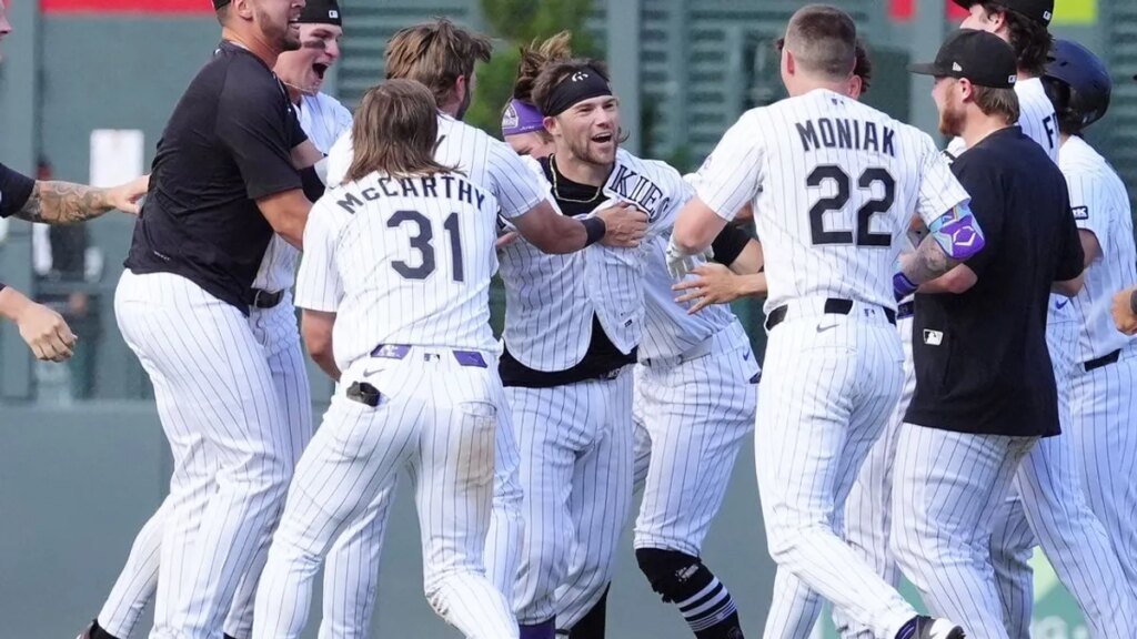 Rockies rally twice to drop Orioles in extras